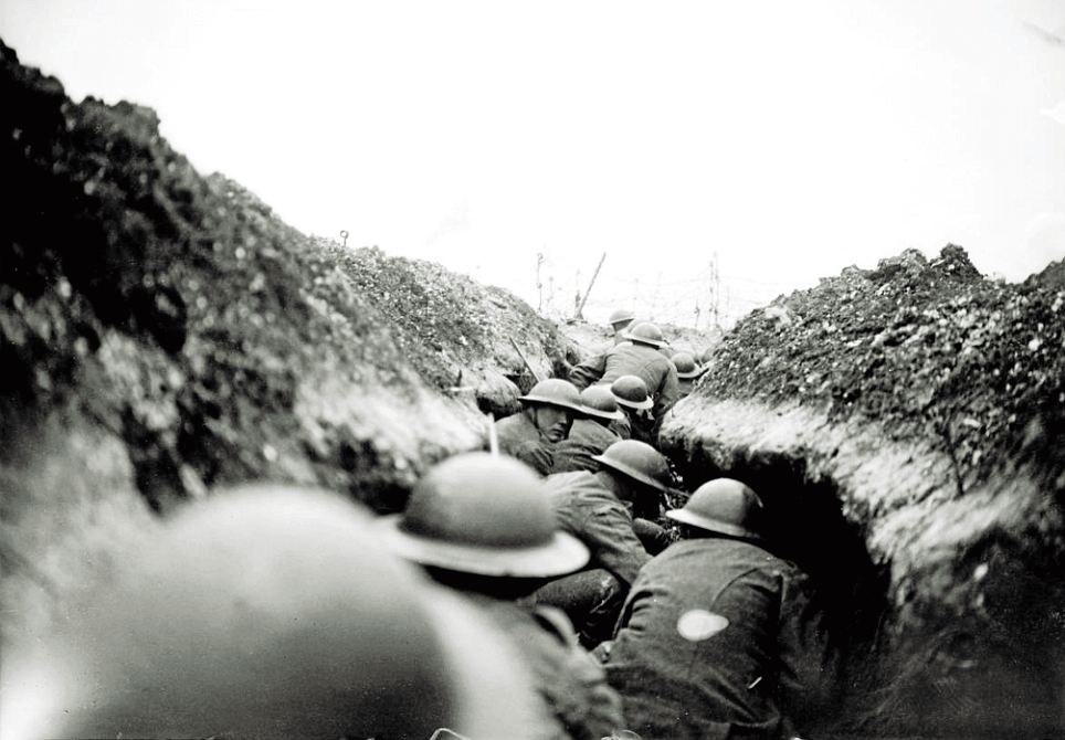 A daylight raiding party of 9th Cameronians (Scottish Rifles) waits for the signal to go over the top near Arras, March 27, 1917: 'You can sense the tension in the face looking back and feel it in the body language of the others as they prepare to go over the top,' says Mr McCullin. 'It's an extraordinary photograph, a very close shot'